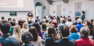 People sitting at a presentation.